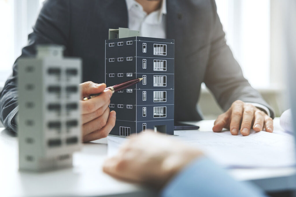 commercial real estate scale model buildings with real estate agents meeting